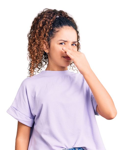 Woman holding nose from odor